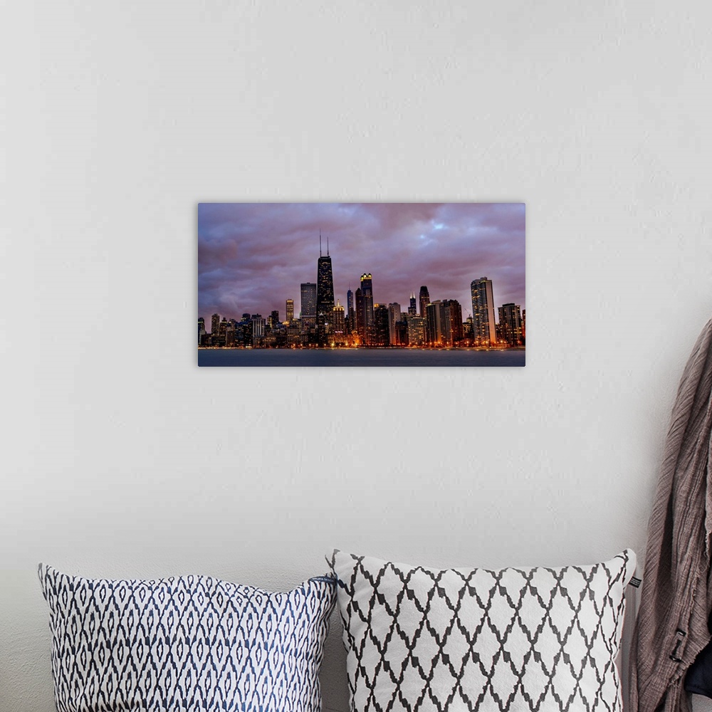 A bohemian room featuring Panoramic Photo of Chicago skyline at night under dramatic clouds.