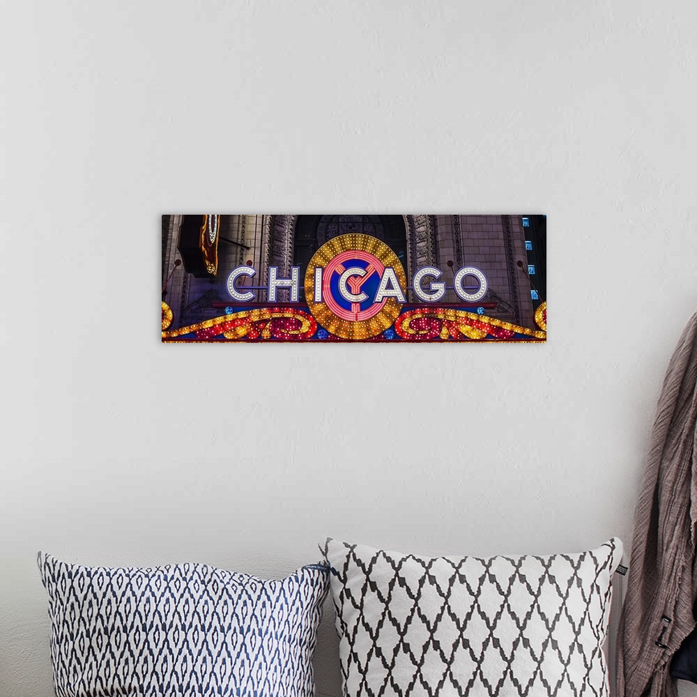 A bohemian room featuring Panoramic image of the Chicago Theater Marquee with glowing lights in the evening.