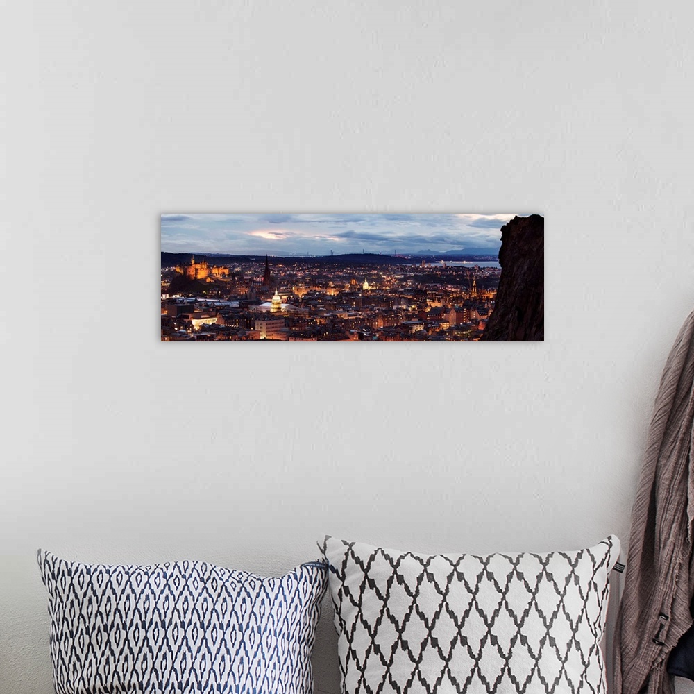 A bohemian room featuring Panoramic photograph of the city of Edinburgh, Scotland lit up at sunset with a view from Holyroo...