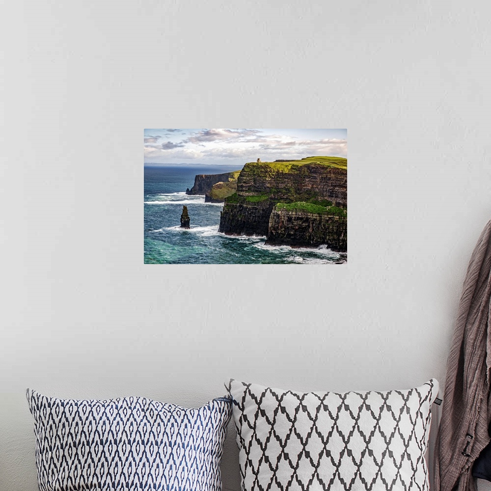 A bohemian room featuring Photograph of the Cliffs of Moher with O'Brien's Tower seen in the distance, marking the highest ...