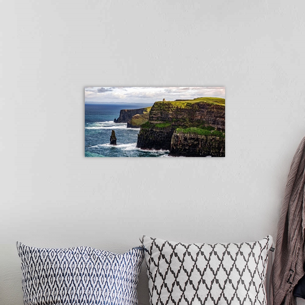 A bohemian room featuring Panoramic photograph of the Cliffs of Moher with O'Brien's Tower seen in the distance, marking th...