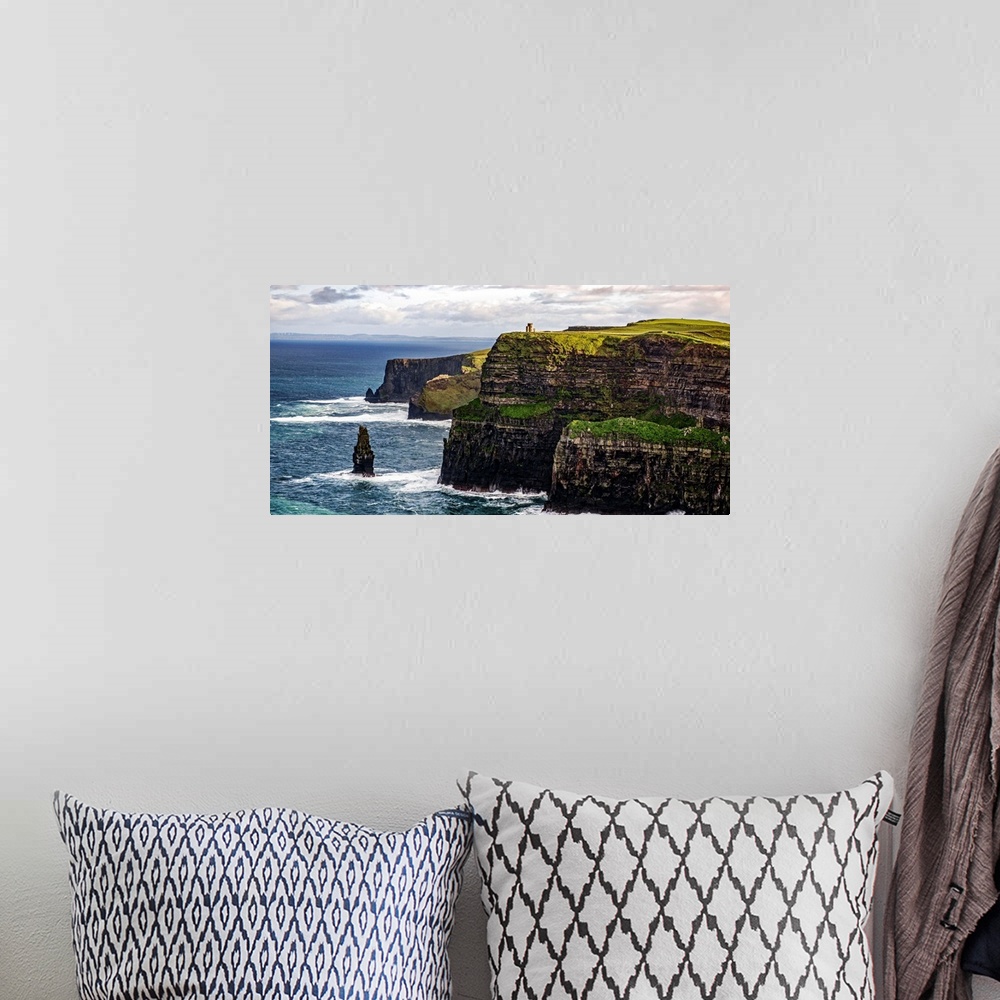 A bohemian room featuring Panoramic photograph of the Cliffs of Moher with O'Brien's Tower seen in the distance, marking th...