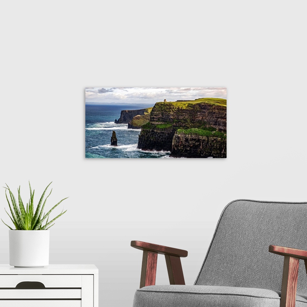 A modern room featuring Panoramic photograph of the Cliffs of Moher with O'Brien's Tower seen in the distance, marking th...