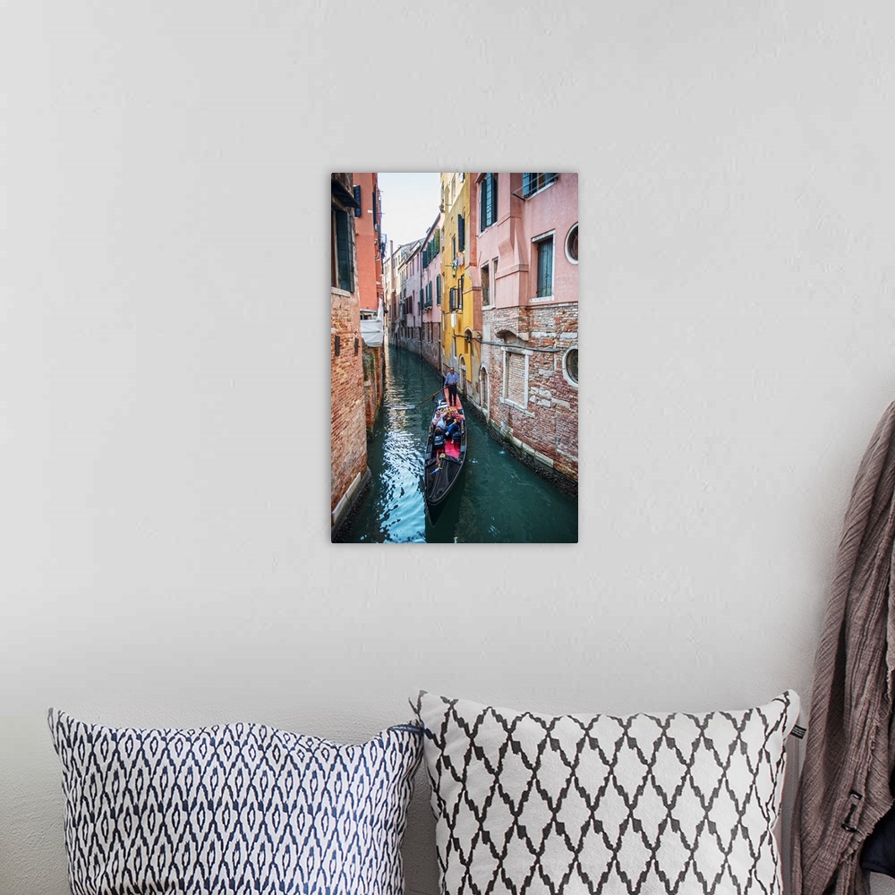 A bohemian room featuring Photograph of a gondola rowing though a canal surrounded by colorful building facades in Venice, ...