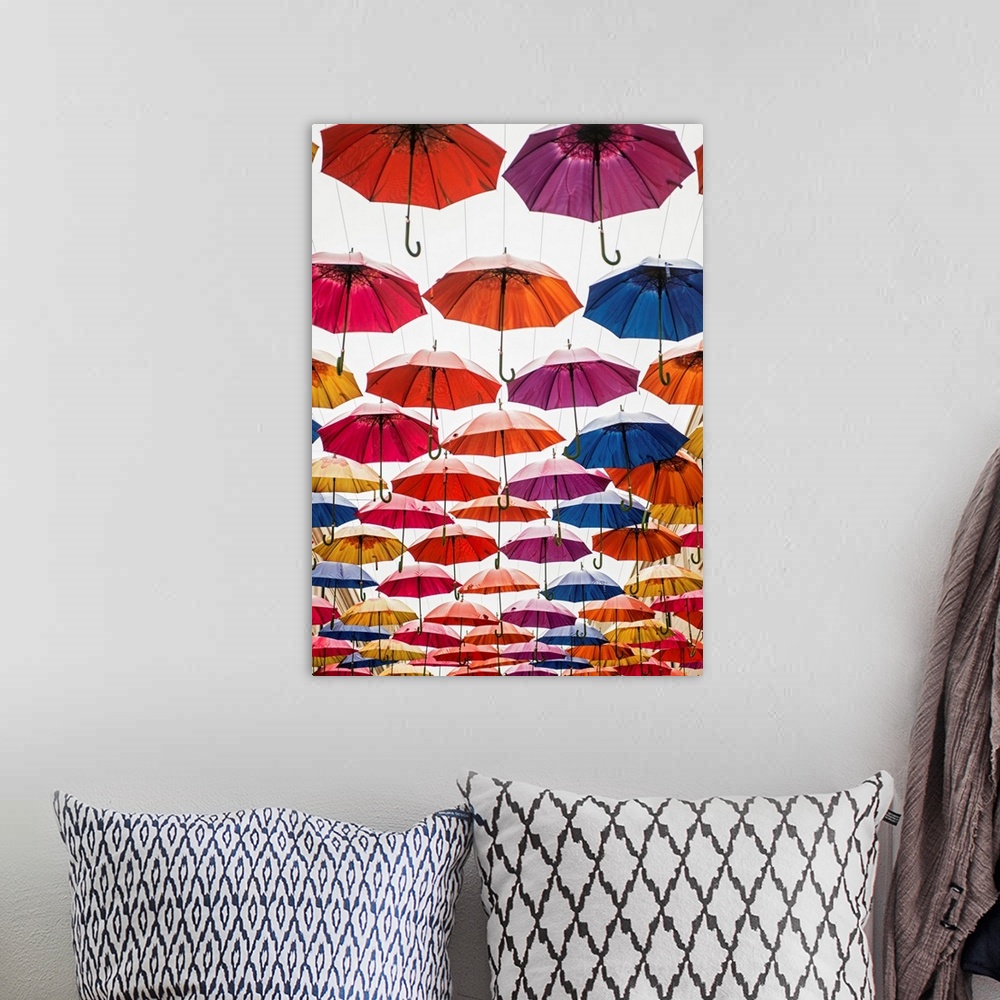 A bohemian room featuring Vertical photograph of the colorful umbrellas hanging in Southgate Shopping Centre in Bath, Engla...