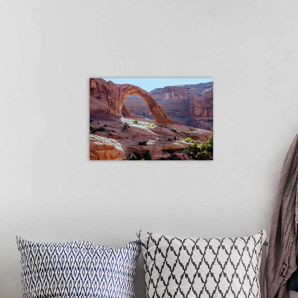 A bohemian room featuring Corona Arch over looking the desert landscape of Bootlegger Canyon in Arches National Park, Utah