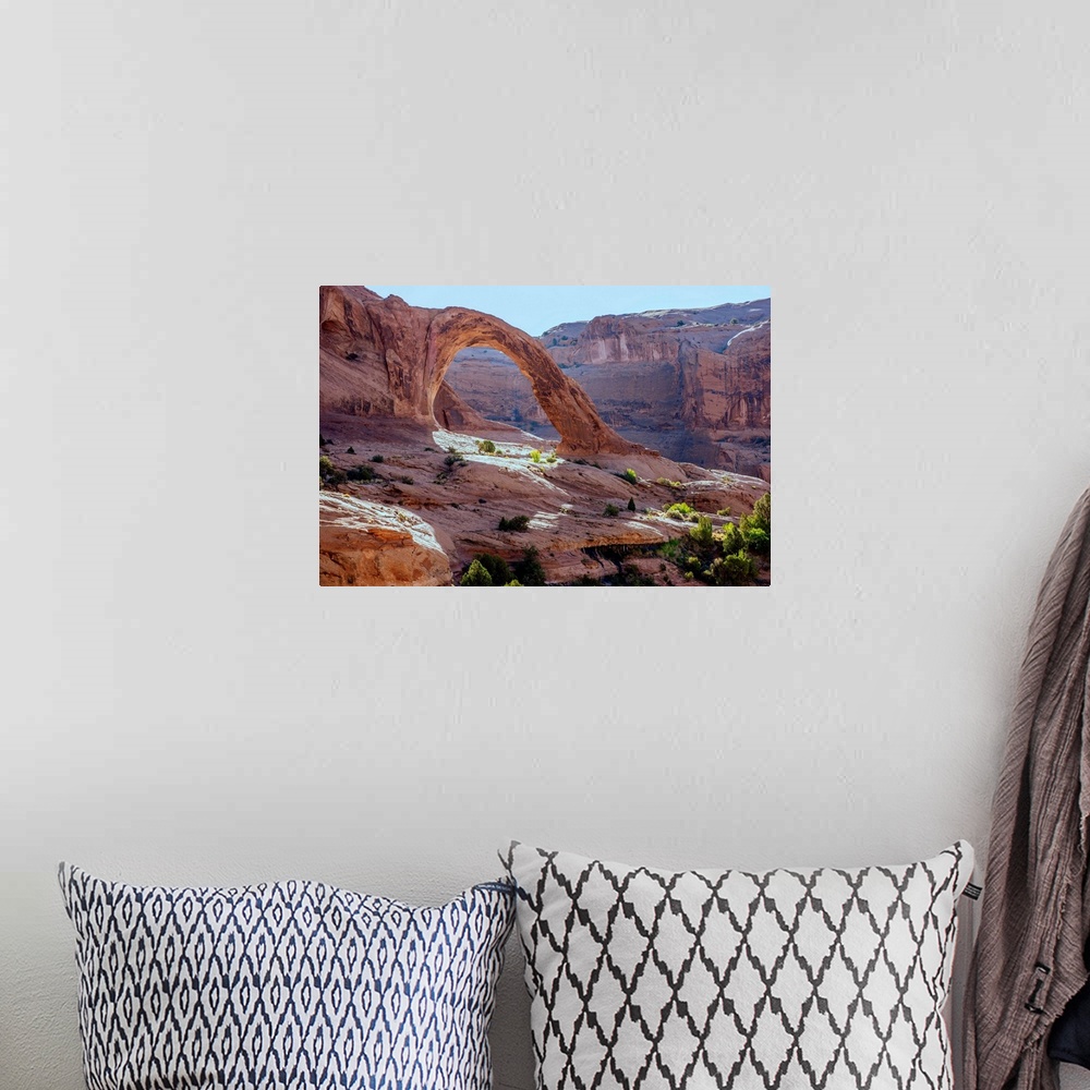 A bohemian room featuring Corona Arch over looking the desert landscape of Bootlegger Canyon in Arches National Park, Utah
