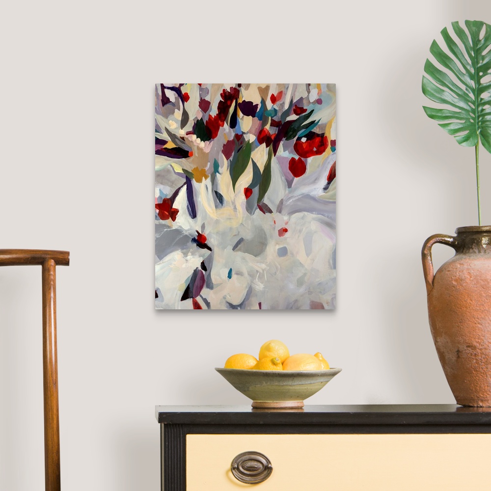 A traditional room featuring Large abstract modern painting of a uniquely arranged bouquet of blooming flowers. Vibrant tones ...