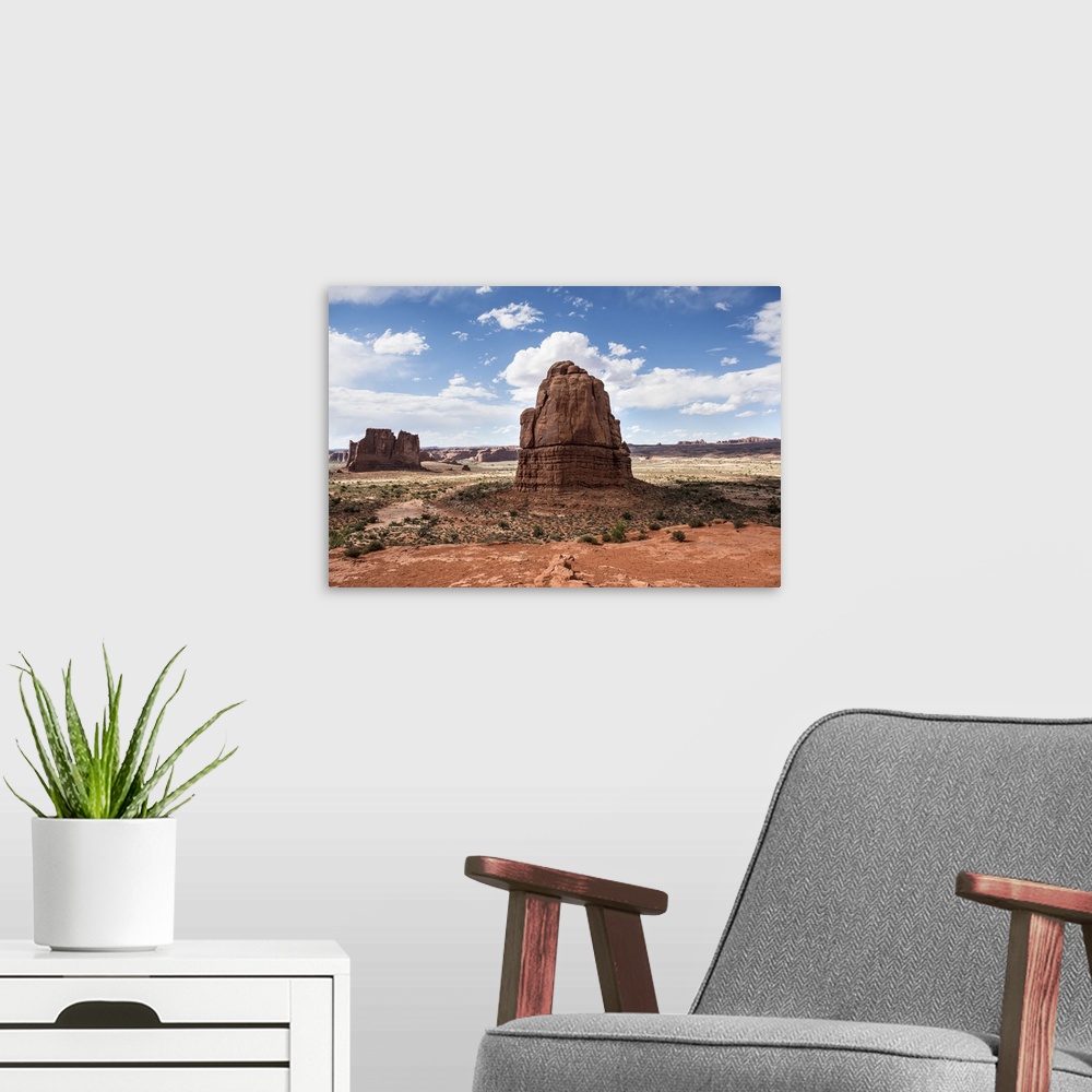 A modern room featuring Sandstone formations, the Courthouse Towers, in the desert landscape of Arches National Park, Utah.
