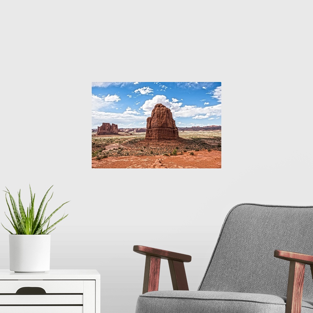 A modern room featuring Sandstone formations, the Courthouse Towers, in the desert landscape of Arches National Park, Utah.