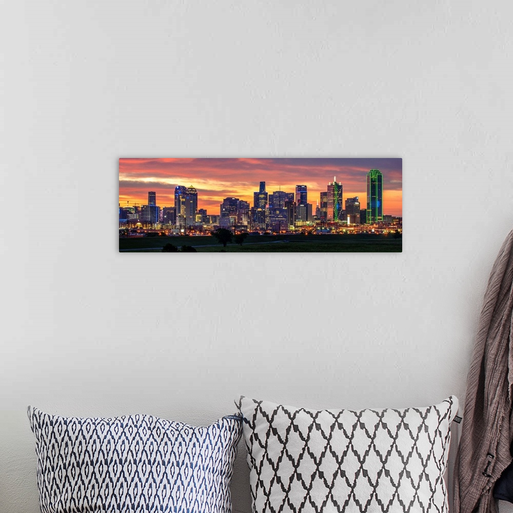 A bohemian room featuring A horizontal image of the Dallas, Texas city skyline with a brilliant sunset.