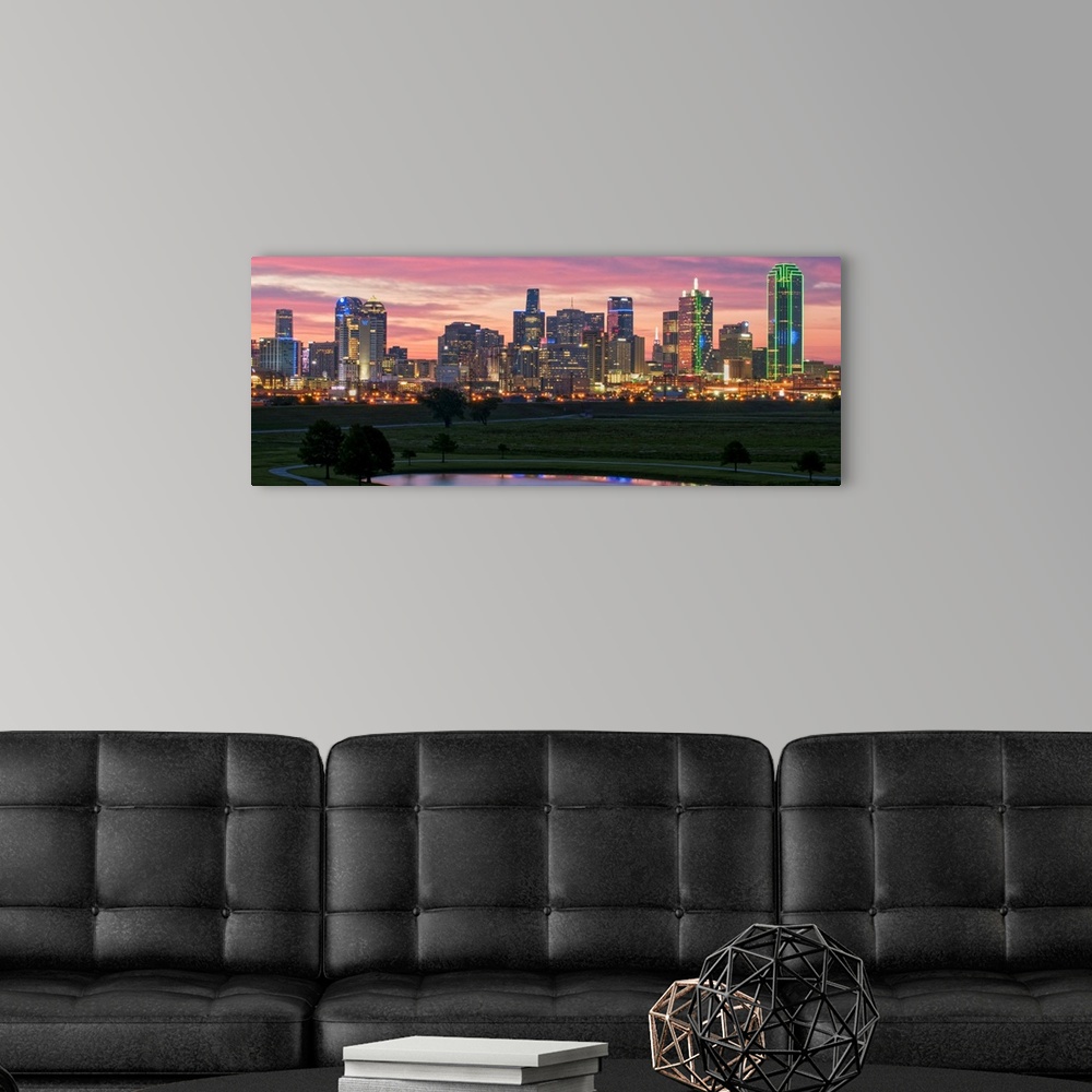 A modern room featuring A horizontal image of the Dallas, Texas city skyline with a brilliant sunset.