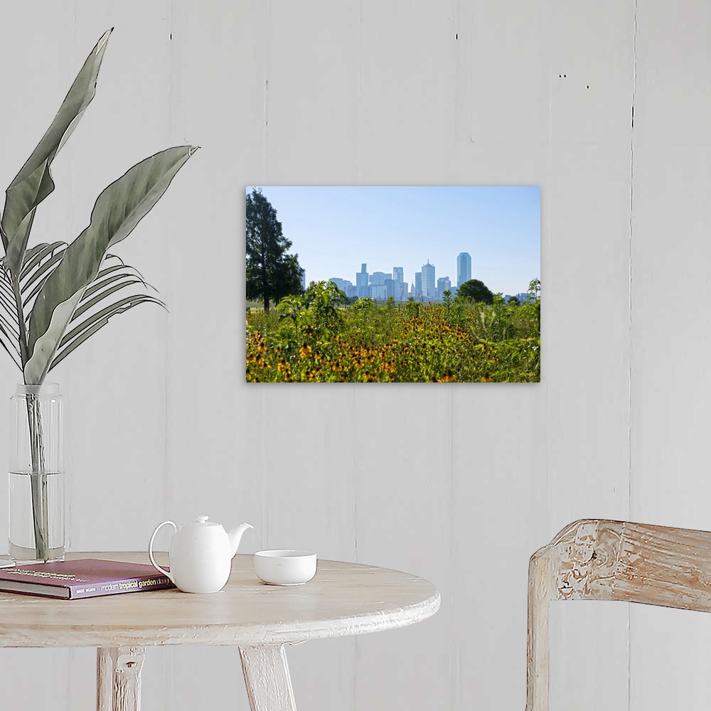 A farmhouse room featuring A field of wild flowers in the foreground of the Dallas Texas skyline.