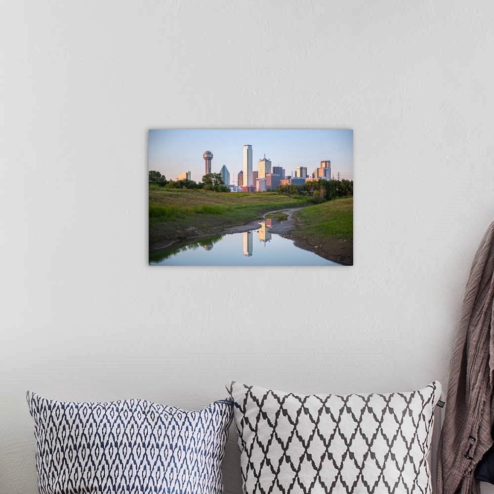A bohemian room featuring A creek in the foreground of the Dallas Texas skyline.