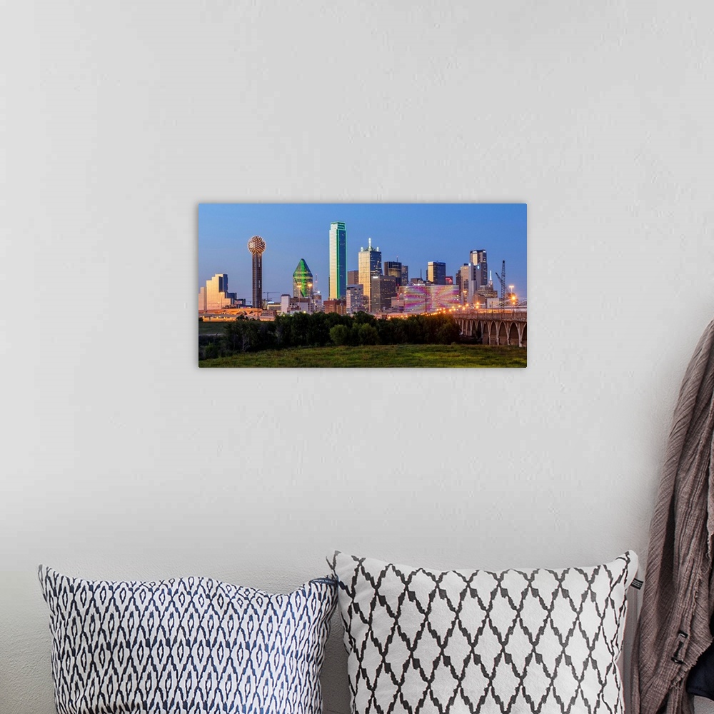 A bohemian room featuring A horizontal image of  the Dallas, Texas city skyline at sunset.