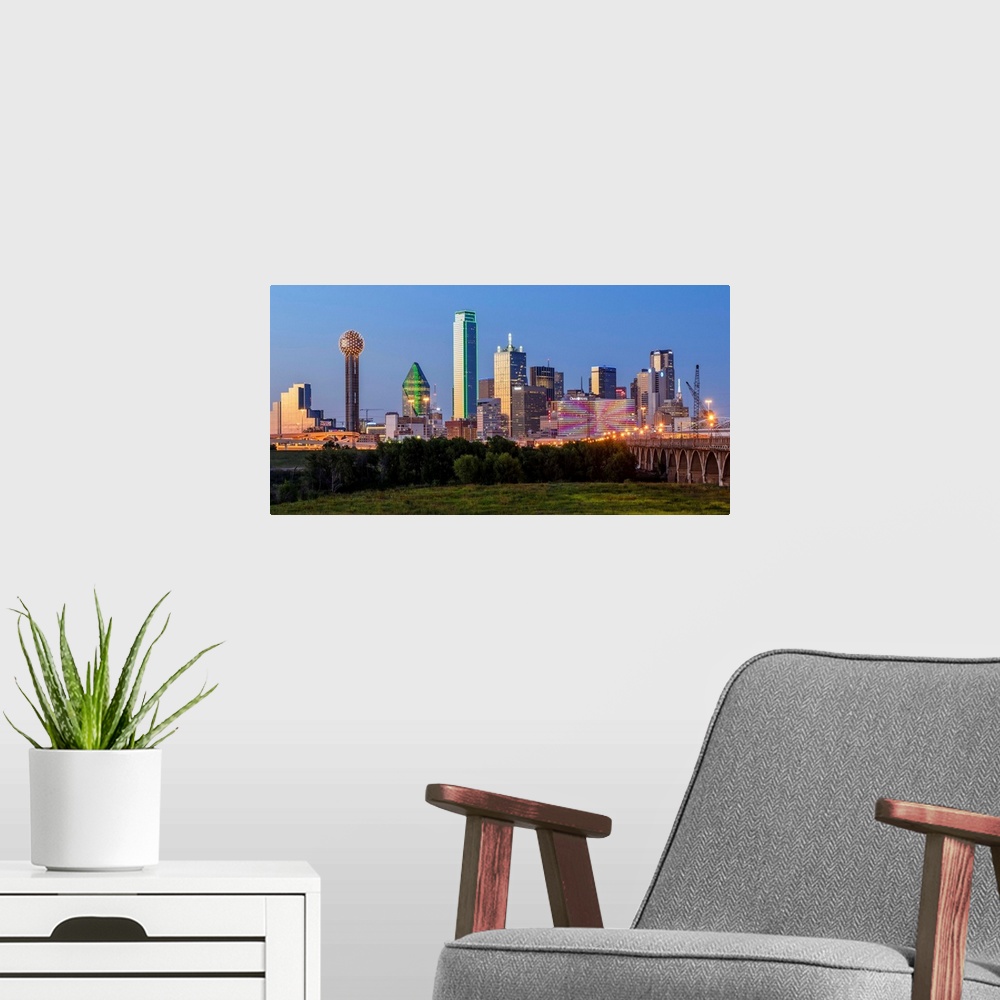 A modern room featuring A horizontal image of  the Dallas, Texas city skyline at sunset.