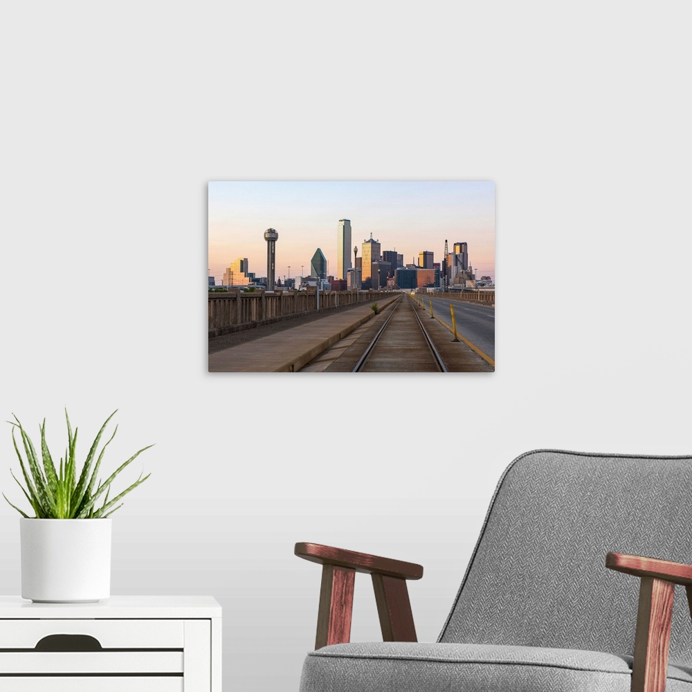 A modern room featuring The city of Dallas, Texas at sunset.