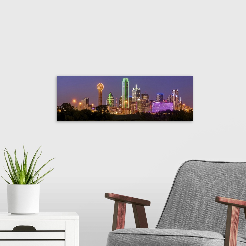 A modern room featuring A horizontal image of the Dallas, Texas city skyline at sunset