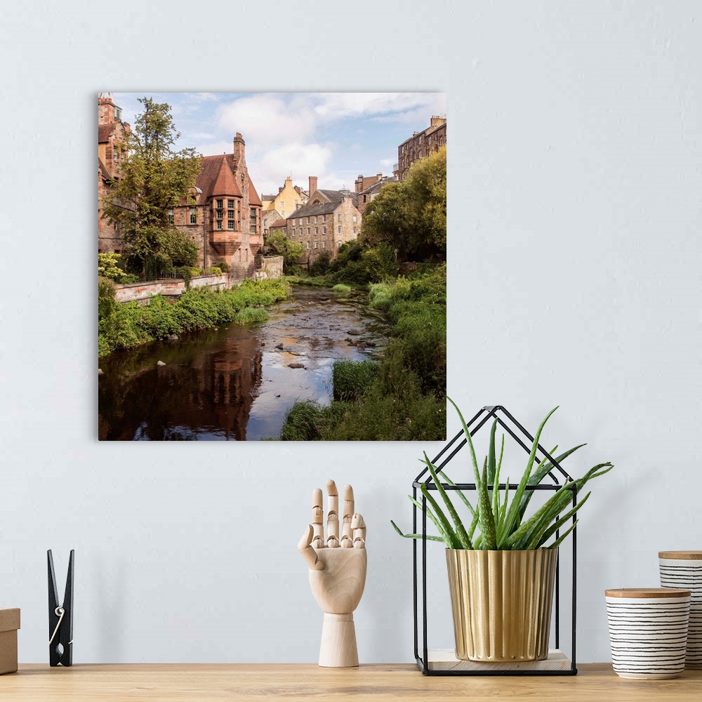 A bohemian room featuring Square photograph of picturesque Dean Village with Water of Leith flowing throwing through the mi...
