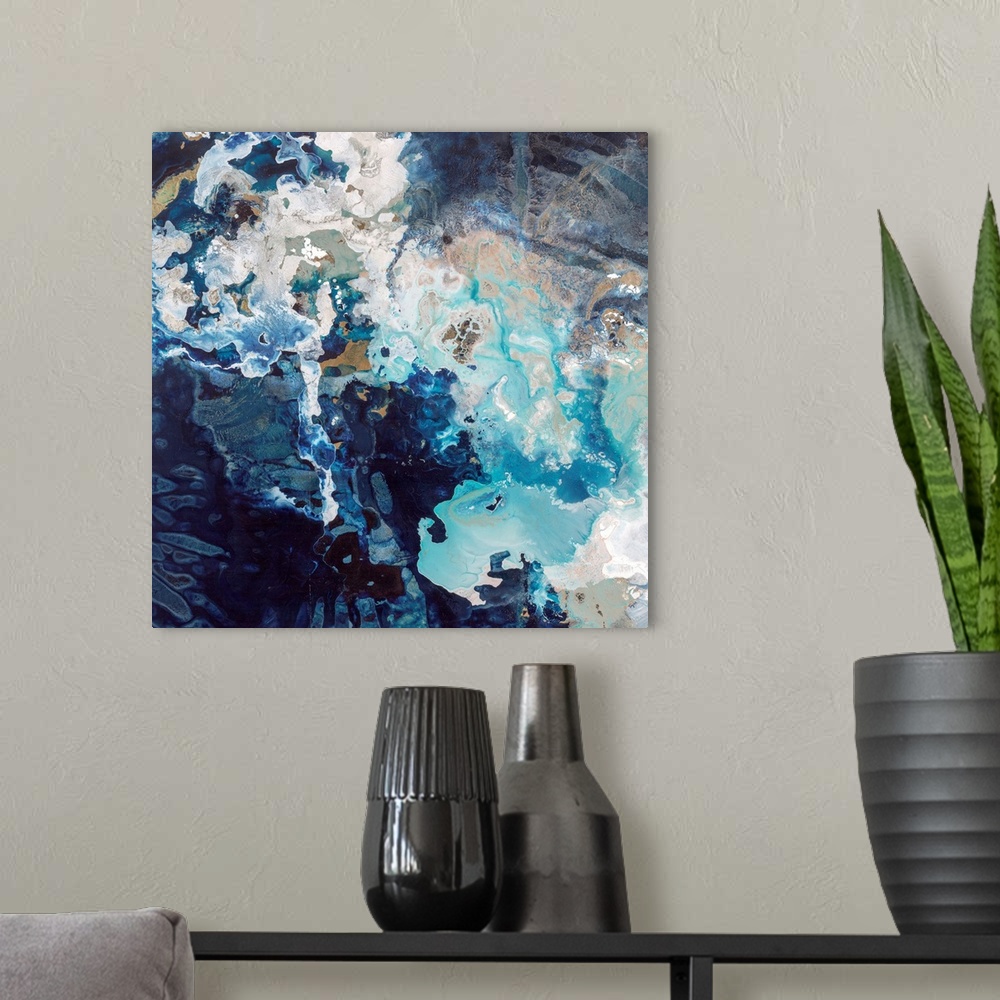 A modern room featuring Abstract contemporary painting with dark navy and bright blue splashes.
