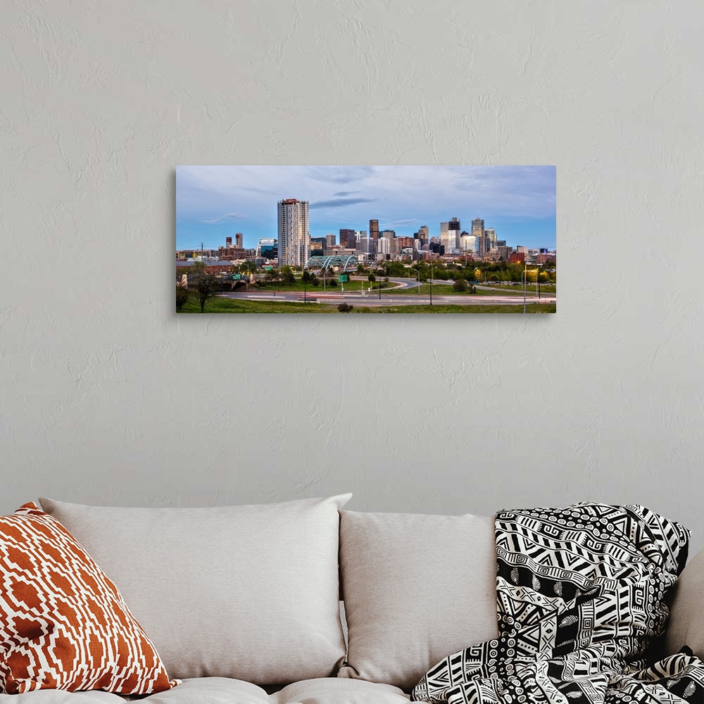 A bohemian room featuring Photograph of the Denver, Colorado skyline with cloudy skies above.