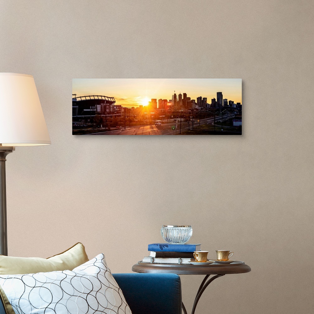 A traditional room featuring Panoramic photo of a Denver skyline against a breathtaking sunrise.