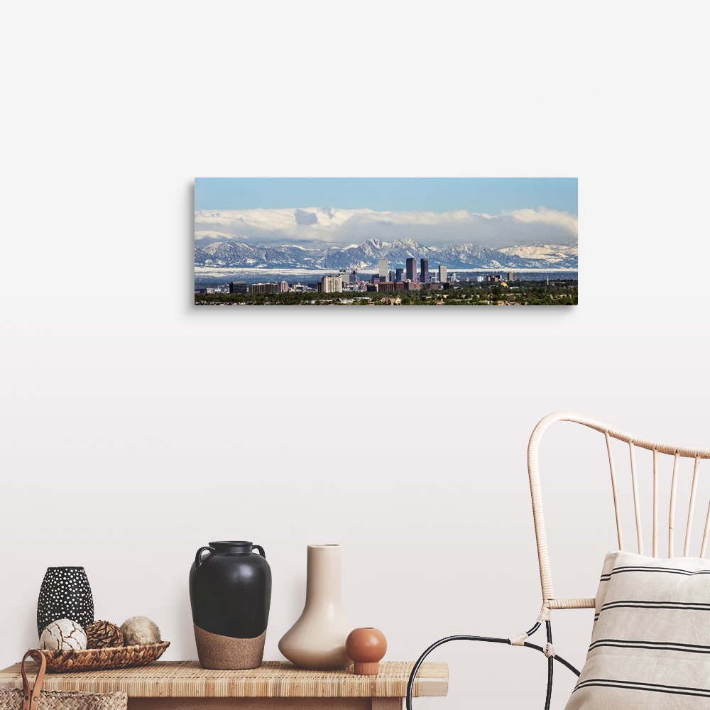 A farmhouse room featuring Panoramic photo of a Denver skyline against a backdrop of the Rocky Mountains.