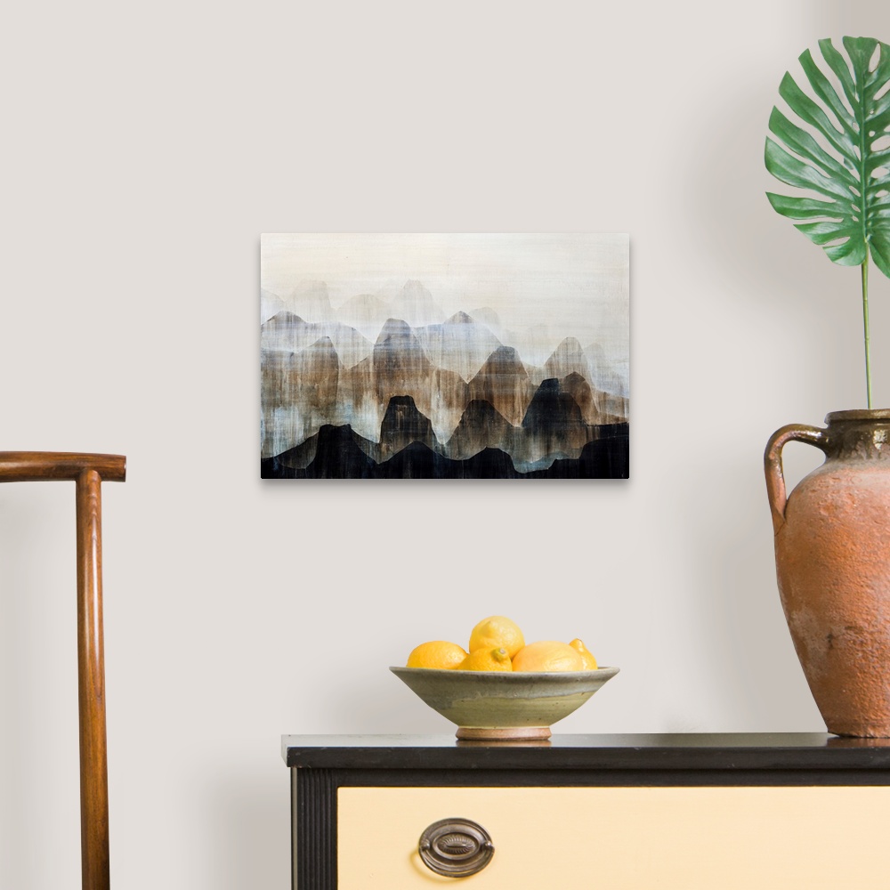 A traditional room featuring Contemporary artwork of a mountain range painted in various earth-tones.