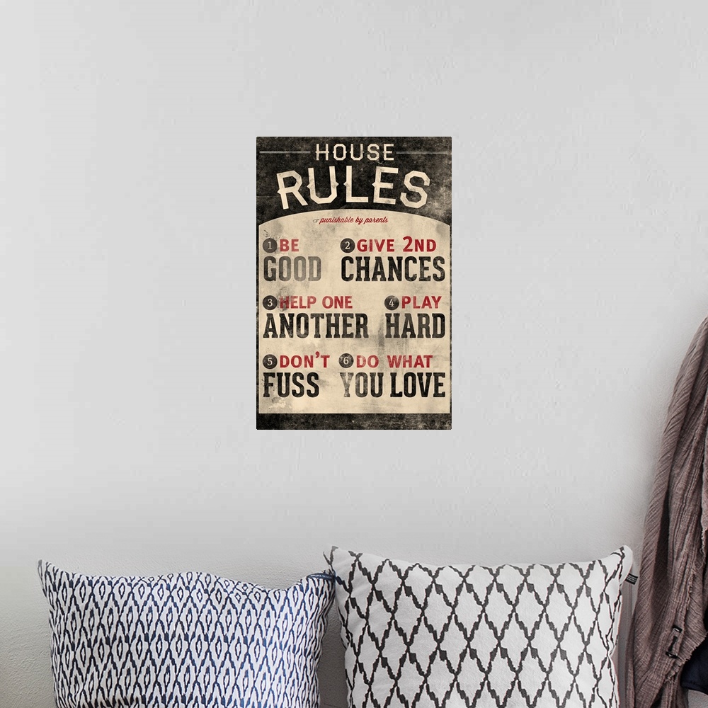 A bohemian room featuring An inspirational poster titled "House Rules". There is a grunge faded look to the print.