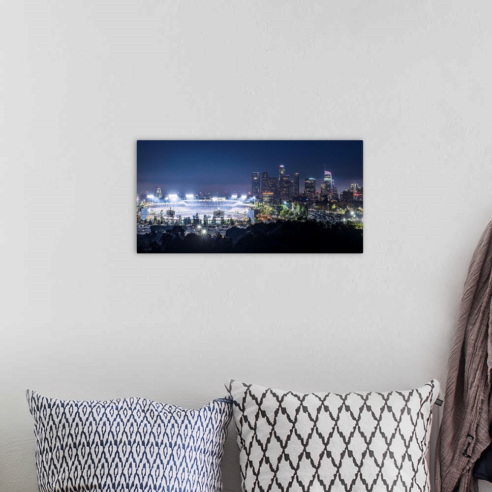 A bohemian room featuring Photograph of Dodger Stadium lit up on a game night with the Los Angeles skyline on the right.