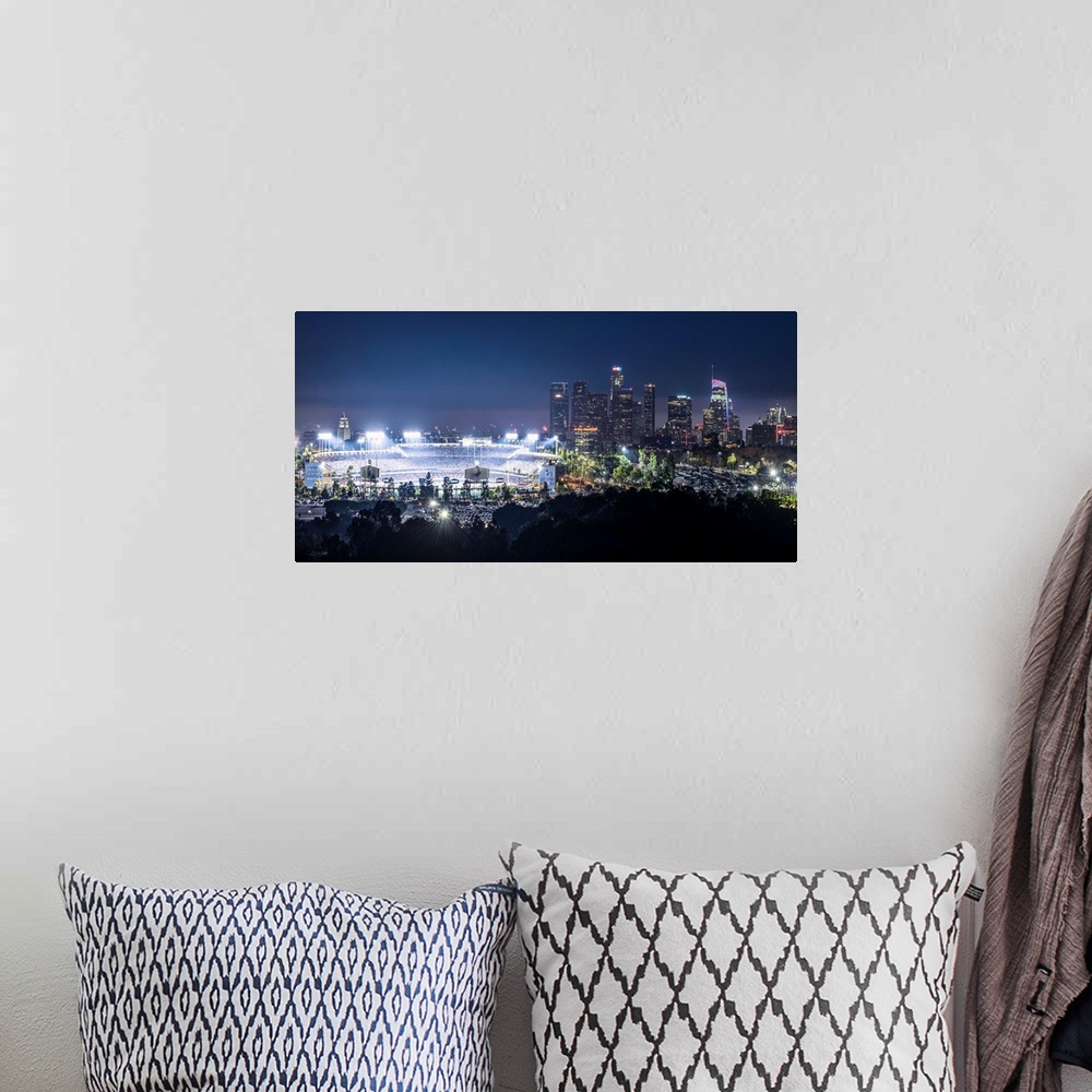 A bohemian room featuring Photograph of Dodger Stadium lit up on a game night with the Los Angeles skyline on the right.