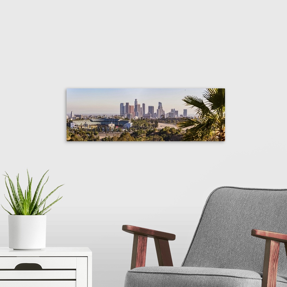 A modern room featuring Panoramic photograph of the downtown Los Angeles skyline with Dodger Stadium on the left and a pa...