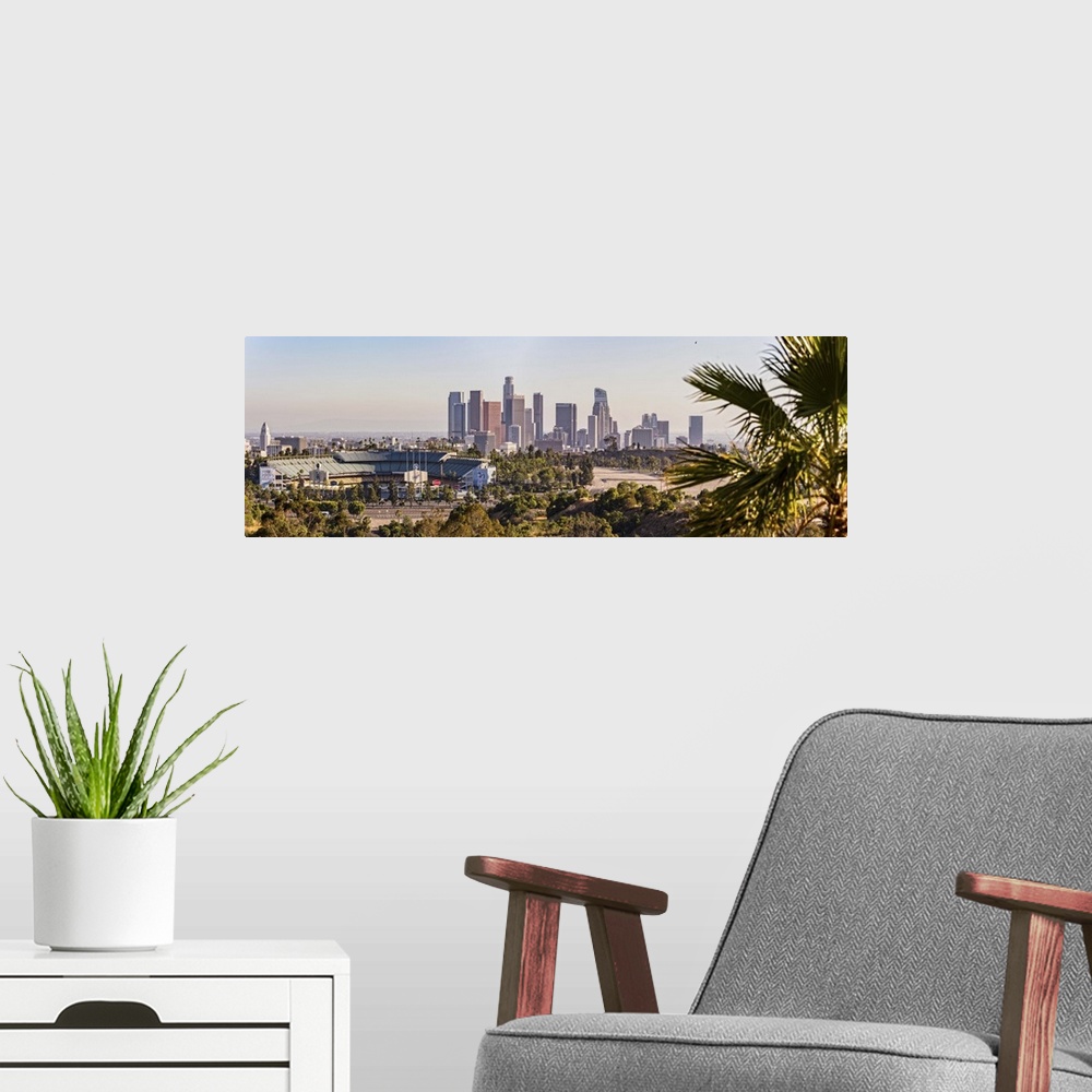 A modern room featuring Panoramic photograph of the downtown Los Angeles skyline with Dodger Stadium on the left and a pa...