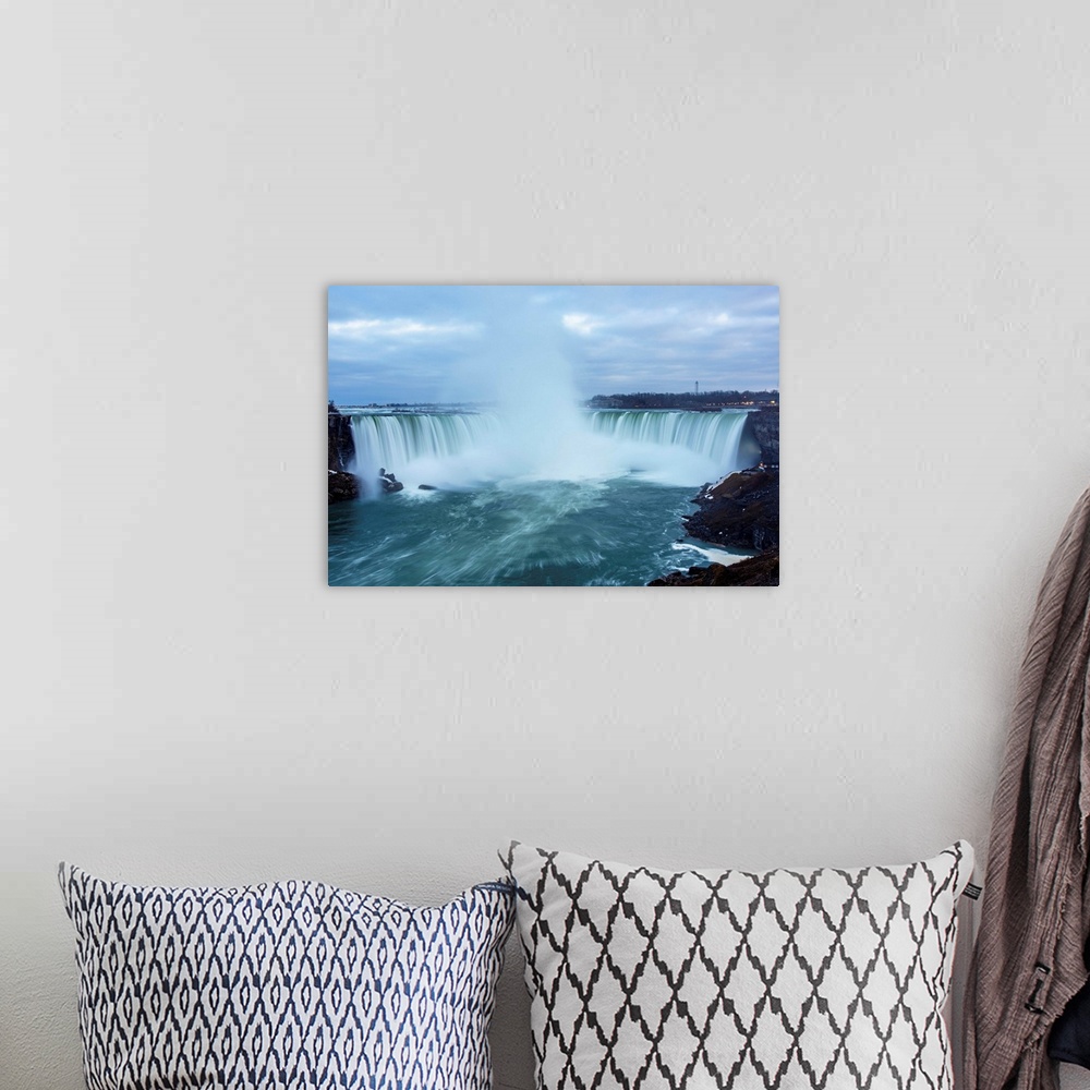A bohemian room featuring Photo of dramatic mist from Horseshoe Falls plunges high into the air.