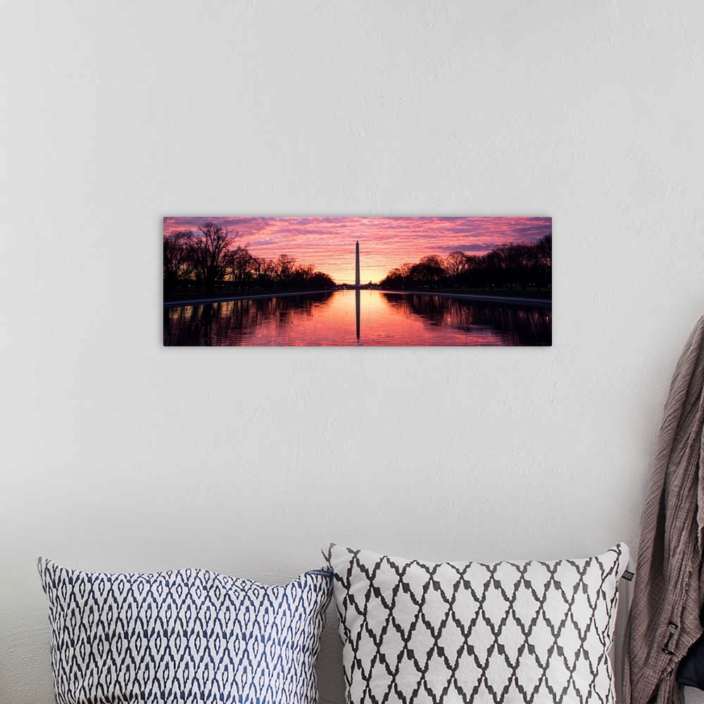 A bohemian room featuring Panoramic photograph of the vibrant clouds at sunset over the Washington Monument on the National...