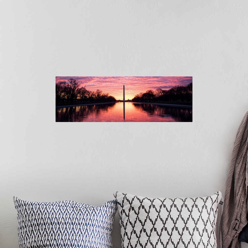 A bohemian room featuring Panoramic photograph of the vibrant clouds at sunset over the Washington Monument on the National...