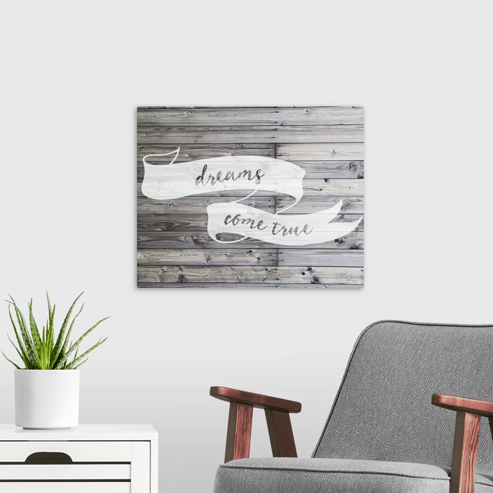 A modern room featuring Inspirational sentiment written on a banner, over grey wooden planks.
