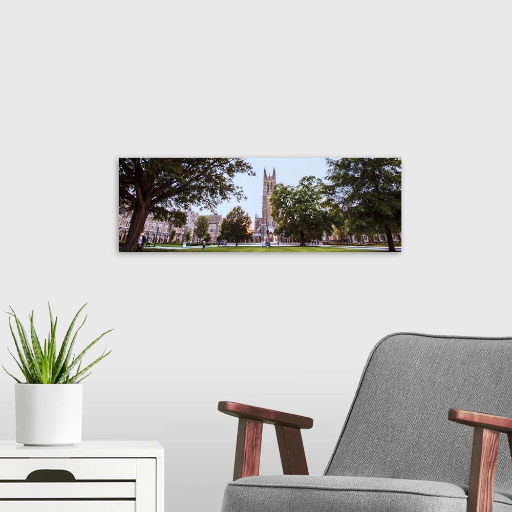 A modern room featuring Steeple of Duke Chapel hidden behind trees on Duke University Campus, Durham, North Carolina.