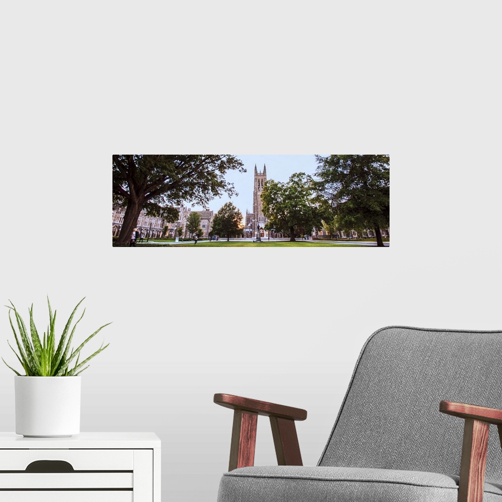 A modern room featuring Steeple of Duke Chapel hidden behind trees on Duke University Campus, Durham, North Carolina.
