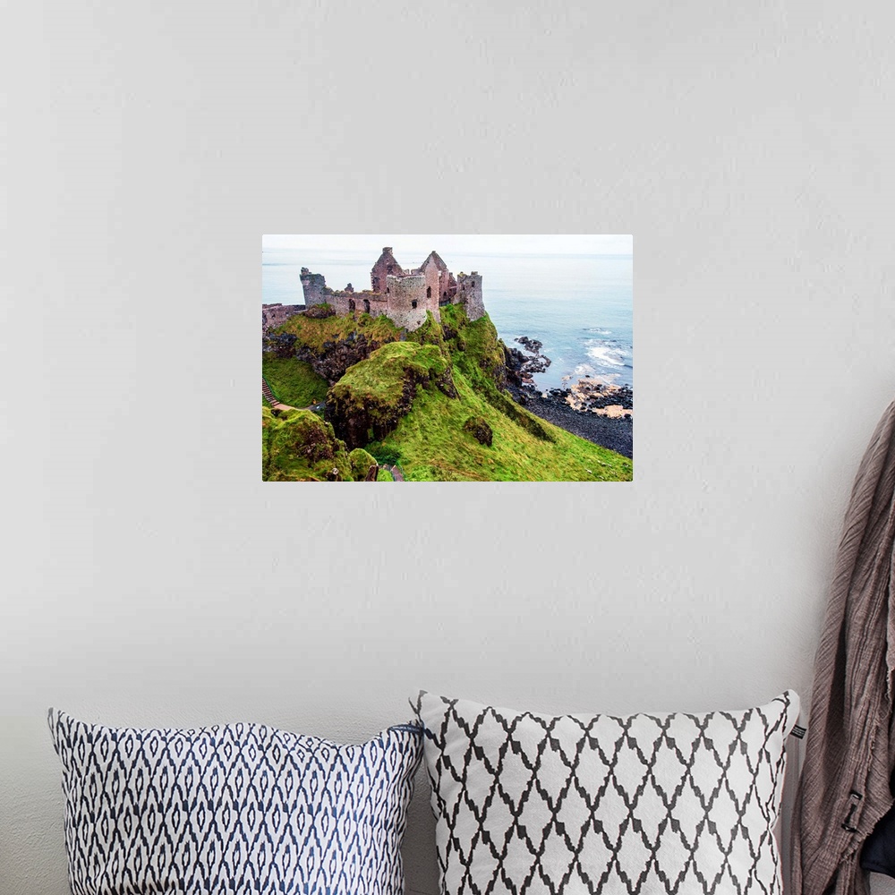 A bohemian room featuring View of now-ruined medieval castle in Northern Ireland.
