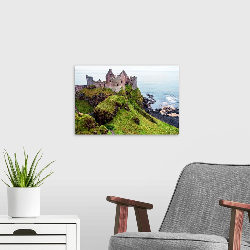 A modern room featuring View of now-ruined medieval castle in Northern Ireland.