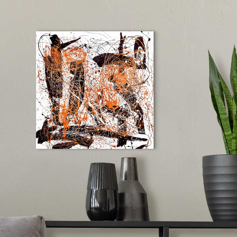 A modern room featuring Abstract contemporary artwork in bold black strokes with orange splatters.