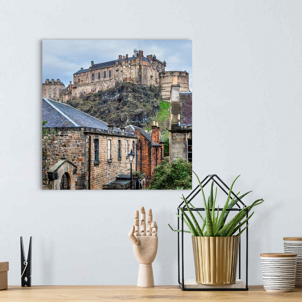 A bohemian room featuring Square photograph of the Edinburgh Castle with old stone buildings in the foreground, Edinburgh, ...