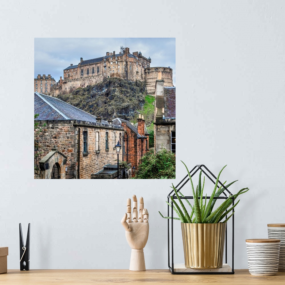 A bohemian room featuring Square photograph of the Edinburgh Castle with old stone buildings in the foreground, Edinburgh, ...