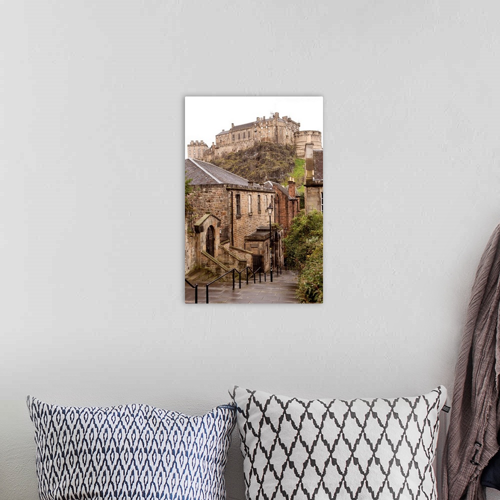 A bohemian room featuring Photograph of Edinburgh Castle with cobblestone buildings in the foreground.