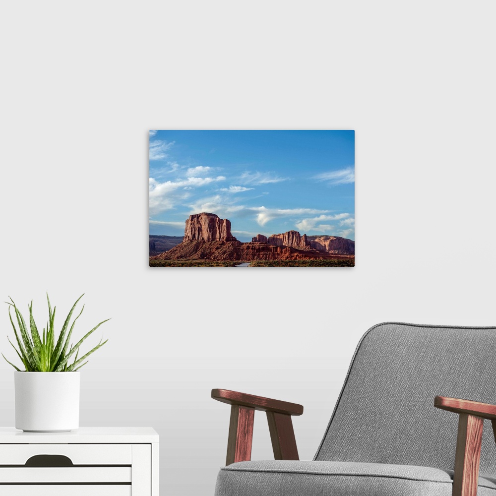 A modern room featuring Blue skies hover over Elephant Butte in Monument Valley, Arizona.