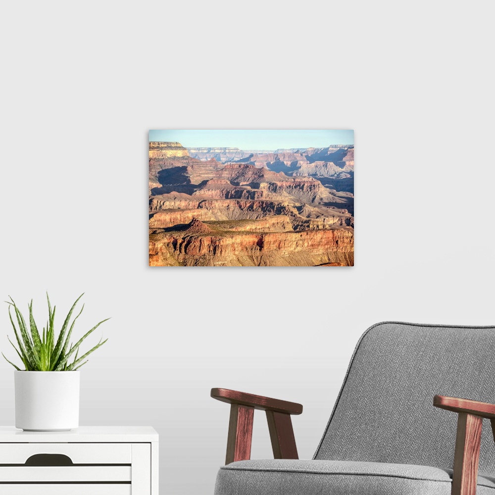 A modern room featuring Elevated view of geological formations at sunrise in Grand Canyon National Park, Arizona.