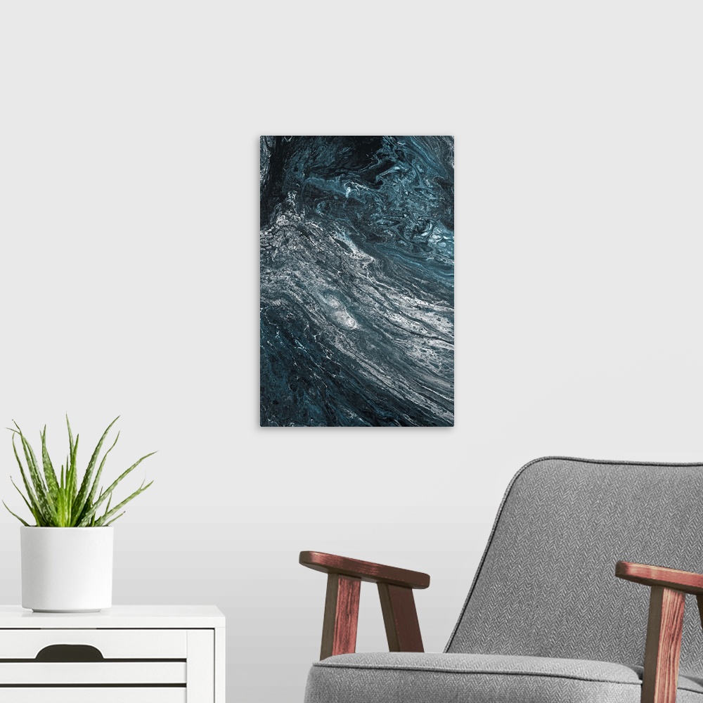 A modern room featuring Abstract contemporary painting in black, white and blue tones, in a marbling effect.