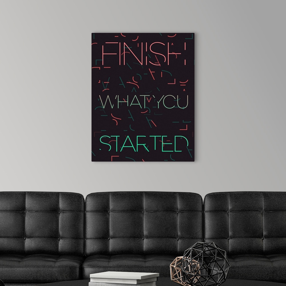 A modern room featuring Typography poster with partially obscured text over a dark background with an abstract design.