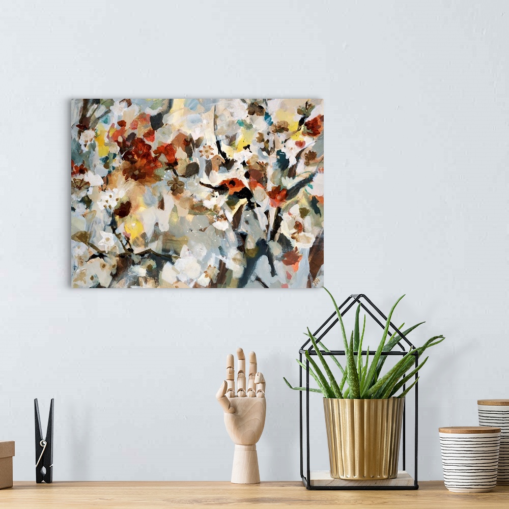 A bohemian room featuring Abstract painting of various types of flowers that are bunched together and uses soft colors.
